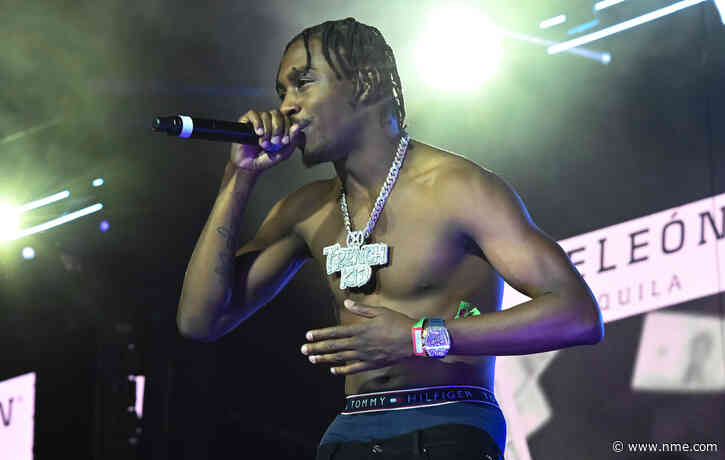 Lil Tjay seen threatening fan at Manchester show after water bottle thrown at stage