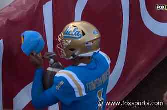 Dorian Thompson-Robinson signs fan’s hat after four-yard rushing touchdown
