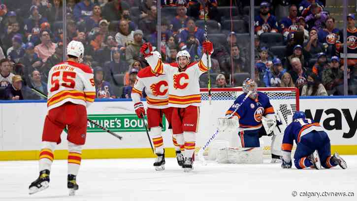 Flames spoil opening of Islanders' new arena with 5-2 win