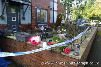 Higher Walton: Floral tributes left as double murder probe continues