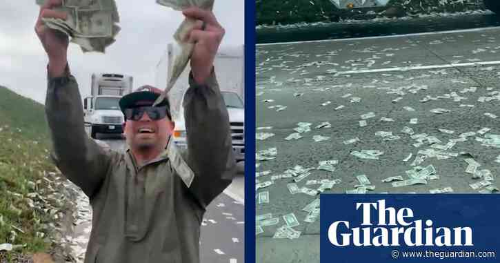 Drivers scramble to grab cash that spilled on to California motorway  – video