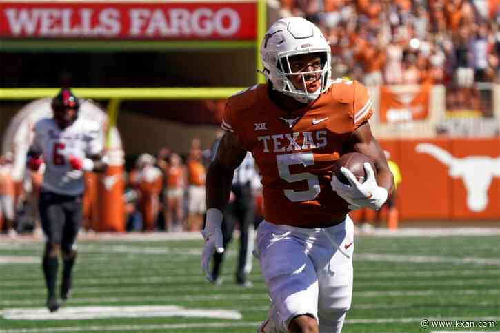 Texas Longhorns running back Bijan Robinson says he'll be back at UT next season