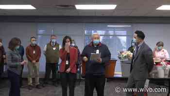 Healthcare workers filling up totes with turkeys for those in need