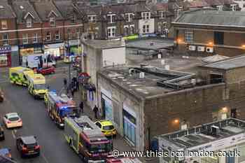 South Wimbledon station - reports of person on tracks