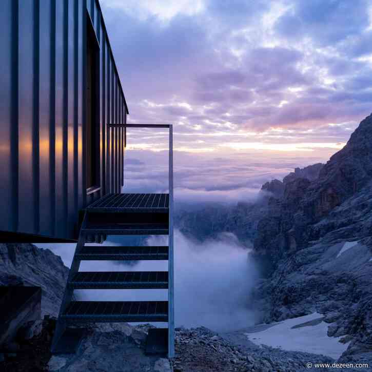 Zinc-clad hikers' cabin perches on a cliff edge in the Dolomites