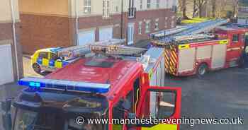 Firefighters rush to flats blaze in Bolton after kitchen fills room with smoke - Manchester Evening News