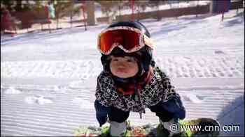 11-month-old learns how to snowboard before she could walk