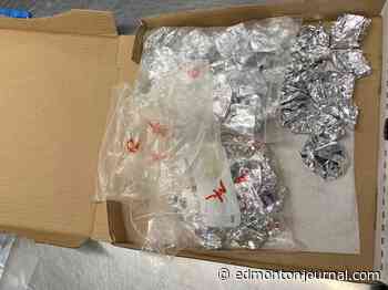 Edmonton Police seize more than $60,000 in drugs and cash at pizza restaurant, charge two men