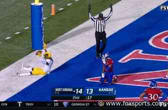 Jarret Doege connects with Sam James for a seven-yard touchdown, West Virginia leads Kansas, 21-13