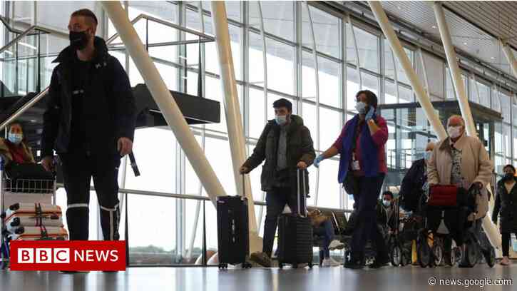 Covid: 13 test positive for Omicron after S Africa-Netherlands flights - BBC News