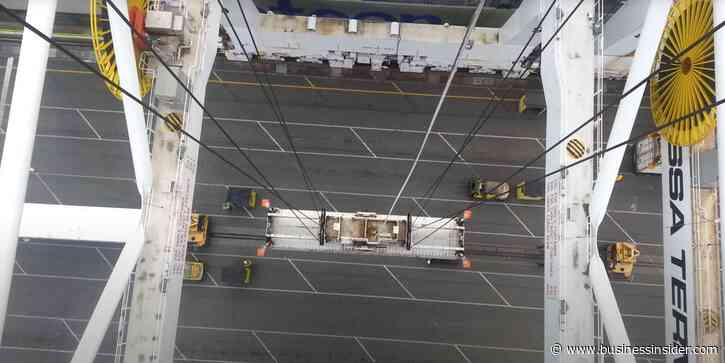 Video shows what a crane operator sees while loading containers onto a cargo ship from over 100 feet in the air