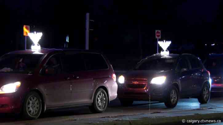 Calgary drivers light up streets with menorahs to celebrate first day of Hanukkah