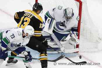 Brad Marchand, Linus Ullmark carry Bruins past Canucks 3-2 - Delta-Optimist