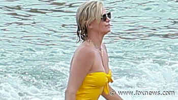 Charlize Theron stuns in yellow one-piece while being a responsible mom on vacation in Mexico