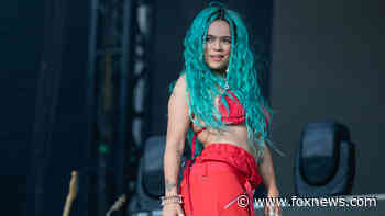 Karol G takes nasty fall down stairs during sold-out concert in Miami