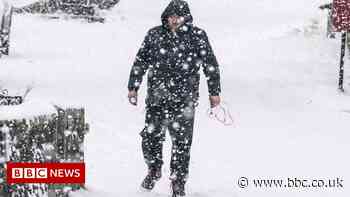 In pictures: Storm Arwen brings snow, waves and winds