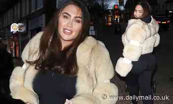 Lauren Goodger wraps up warm in a cream faux fur coat as she takes daughter Larose for a stroll