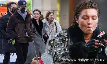 Florence Pugh puffs on a cigarette while bundled up as she enjoys a day out with Zach Braff