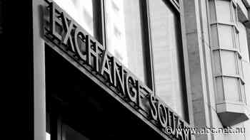 Stocks fall as US central bank says stimulus will be reduced