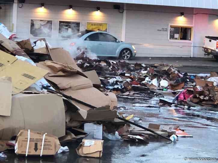 LIVE: Pile of trash on fire, dumped in south Austin parking lot