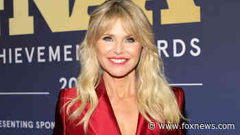 Christie Brinkley, 67, takes the plunge in a red hot pantsuit for the 2021 Footwear News Achievement Awards