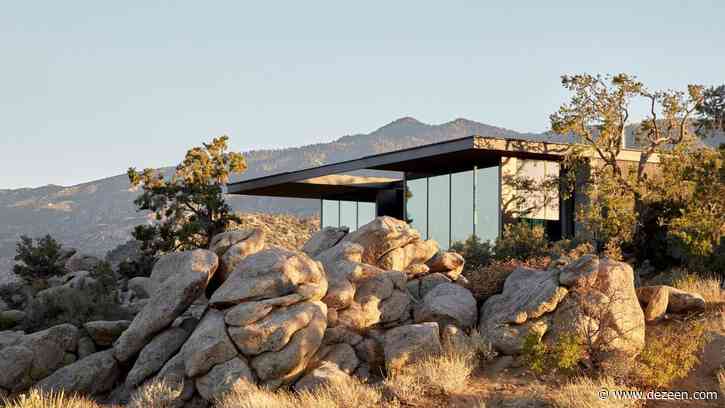 Boulders and pine trees surround High Desert Retreat by Aidlin Darling Design