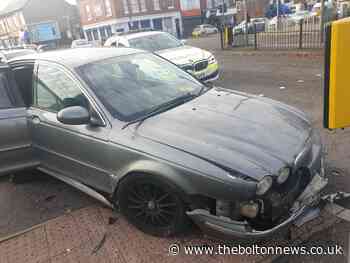 Man charged after Jaguar crashed following police chase through Bolton