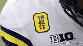 Michigan scores 42 points in Big Ten title game as they honor Oxford High School shooting victims