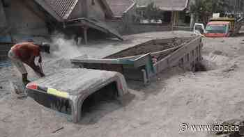 Indonesia volcano rescue hindered by debris, thick mud