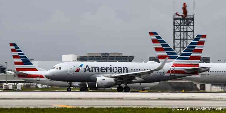 Officials investigate claims that a passenger carried a loaded handgun on an American Airlines flight to Miami