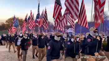 Masked White nationalist group marches on Lincoln Memorial with plastic shields