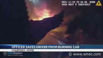 WATCH: NYPD officer saves driver from burning car