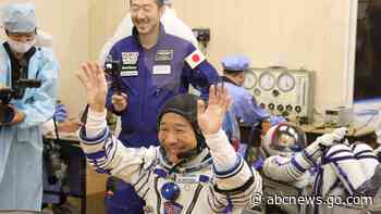 Japanese tourists dock at International Space Station