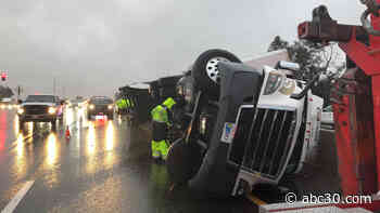 Semi-truck overturns onto Highway 99 in Fresno; SB traffic backed up