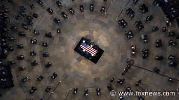 Bob Dole lies in state in Capitol Rotunda, where Biden, lawmakers pay tribute to 'giant of our history'