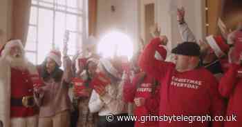 Small businesses form choir and sing Wizzard to highlight their plight - Grimsby Live