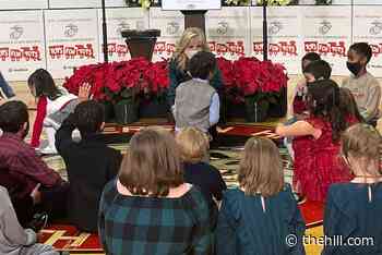 Jill Biden sorts donated toys with military children for annual holiday event