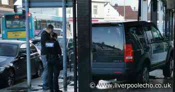 Land Rover mounts kerb and crashes into shop beam - Liverpool Echo