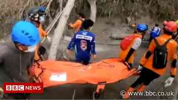 Indonesia volcano: Volunteers struggle to recover the dead, metres deep in ash and mud