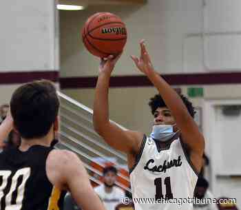 After sitting out with two fouls, Lockport's Anthony Munson felt, 'I owe my team one.' His answer? A couple of threes to top Andrew. - Chicago Tribune