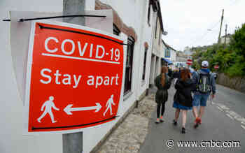 UK hikes its coronavirus threat level as omicron variant surges - CNBC