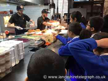 Pupils learn about food preparation at GDK Restaurant