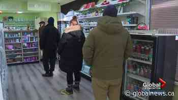 Albertans line up to get their free rapid antigen COVID-19 test kits