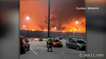 Firefighters investigating QVC Distribution Center fire, one person still missing