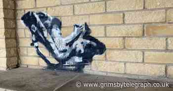 Banksy style graffiti pops up in Humberston bus shelter - Grimsby Live