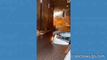 WATCH:  Motorist drives out from tunnel filling with snow