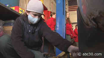 Female mechanic teaches girl scout troop basic car maintenance