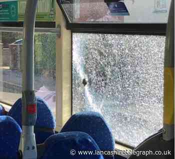 'The police need to find them and chuck them in the cells over Christmas and New Year' - Readers react to bus window being smashed as groups of thugs gather and throw rocks in Burnley