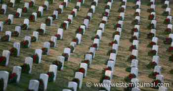 As Volunteers Adorn Veterans' Graves with Wreaths, Protest Group Tries to End the 'Atrocity'