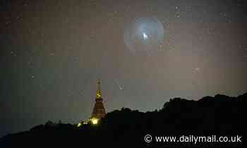 Comet Leonard soars behind the plume from NASA's James Webb Space Telescope launch